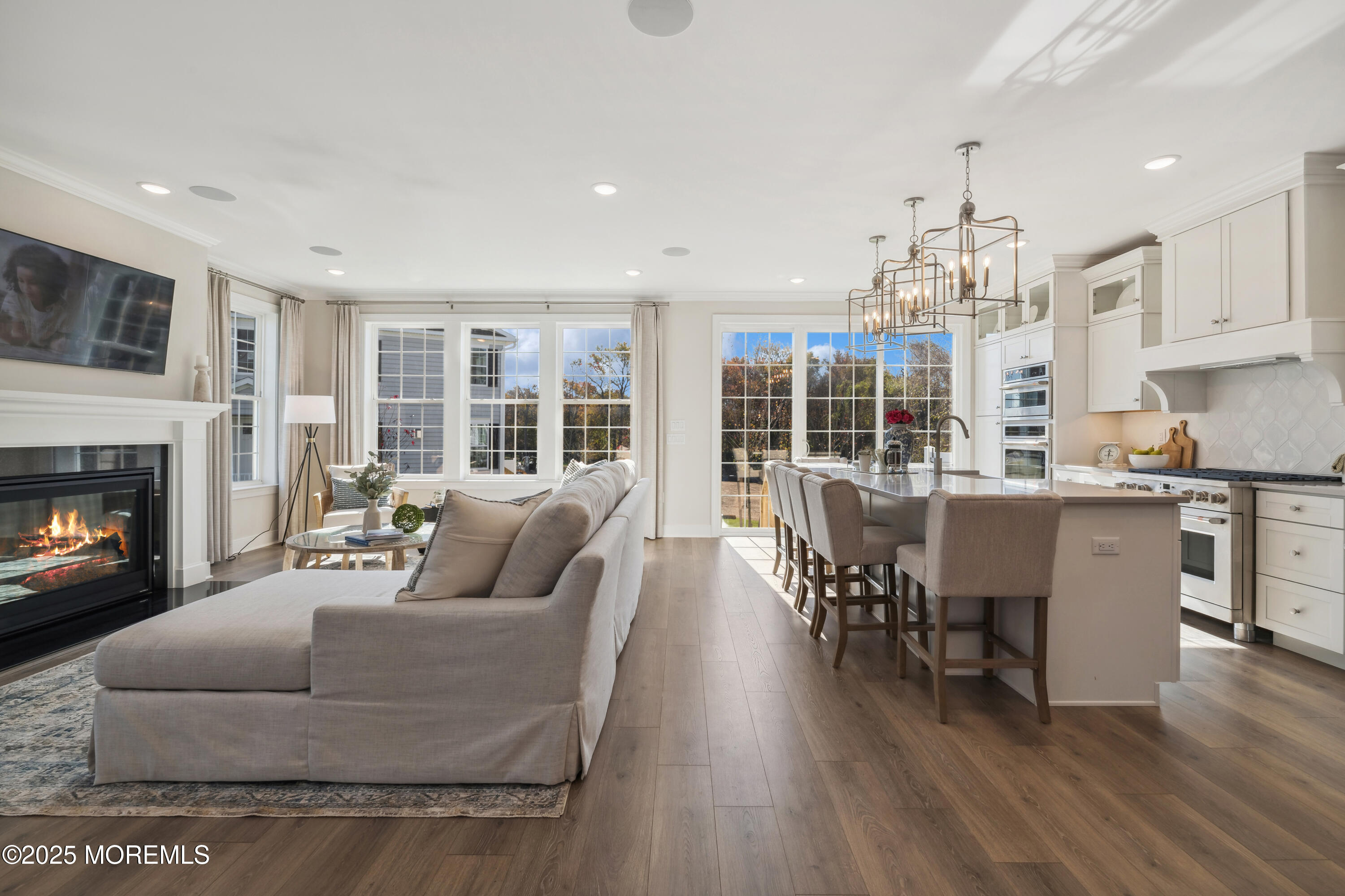 3043 Quail Ridge Boulevard Farmingdale, NJ 07727 - Photo 5 of 36 a living room with furniture a dining table and a fireplace
