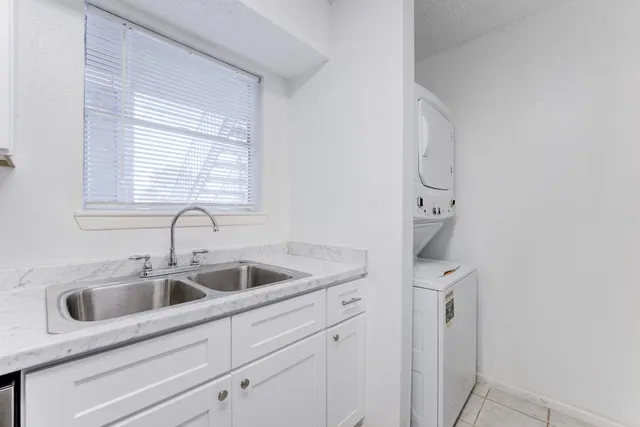 a close view of a sink a faucet and cabinets in a room
