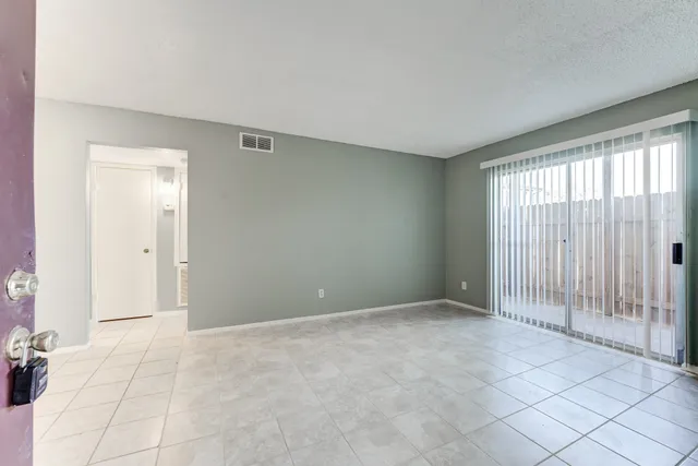 an empty room with sliding door