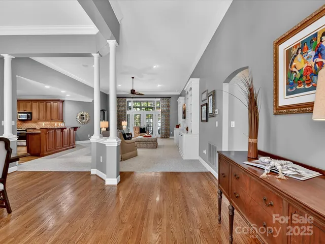 a living room with furniture and a table