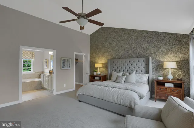 a kitchen with stainless steel appliances granite countertop a stove top oven a sink a dining table and chairs with wooden floor