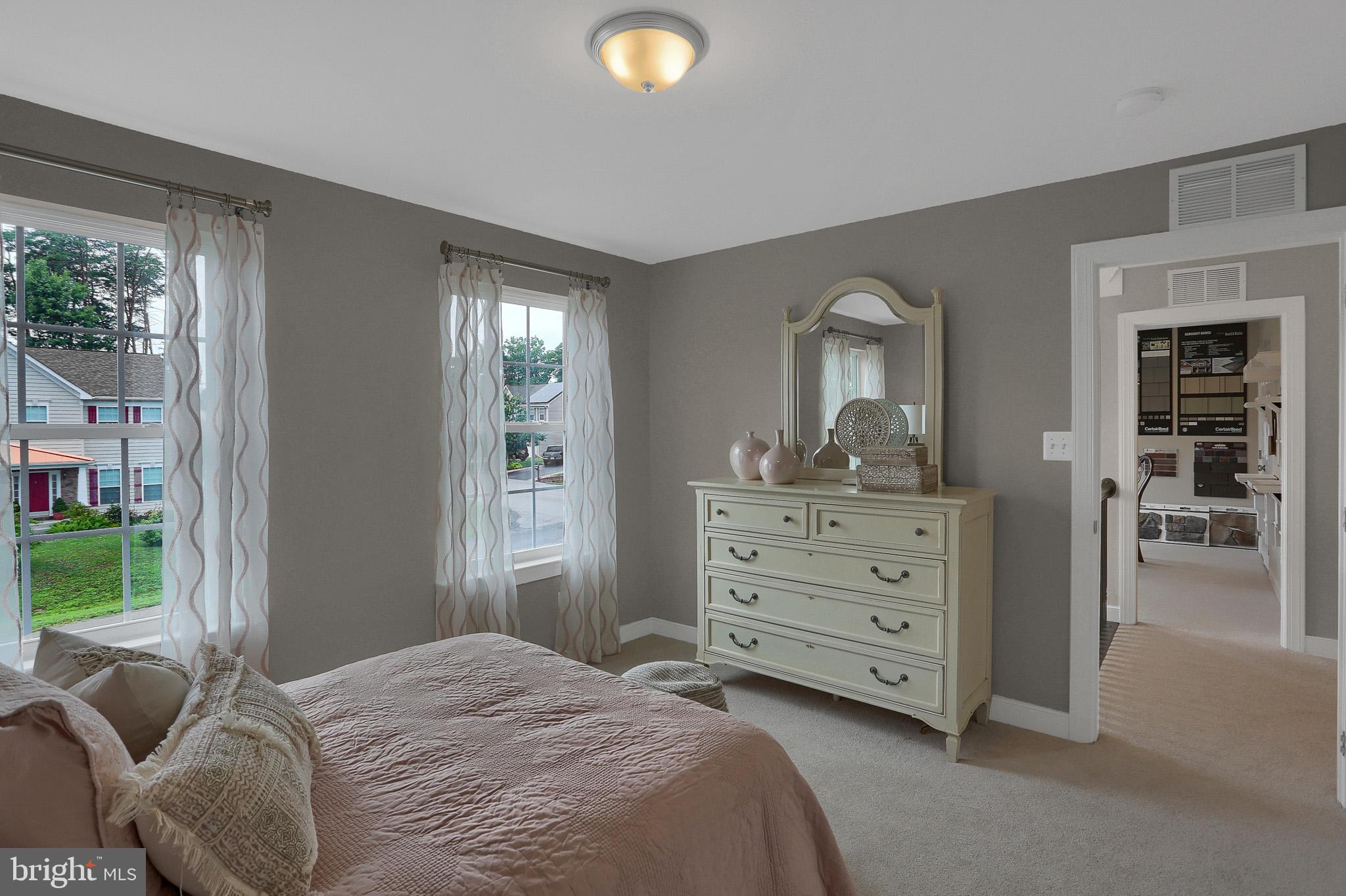 1205 Van Bibber Road Edgewood, MD 21040 - Photo 3 of 17 a bedroom with a bed and a mirror on dresser