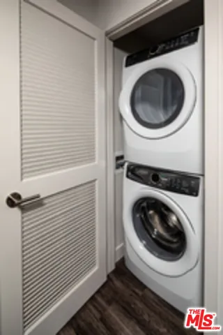 a bedroom with bed and a night stand