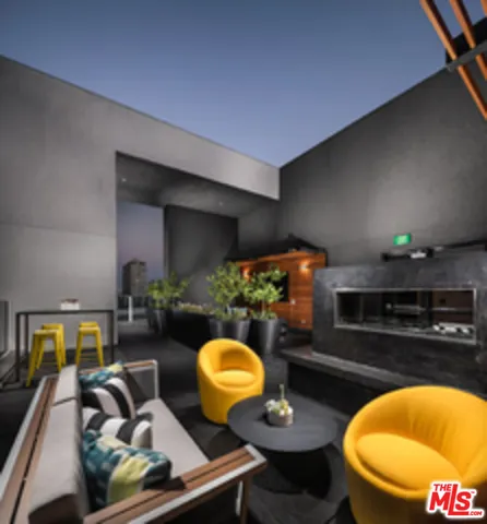 a living room with furniture and lamp