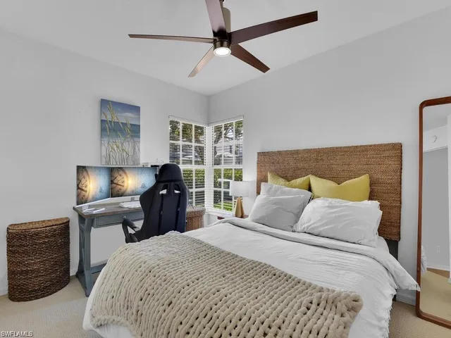 a bedroom with a bed and a chair