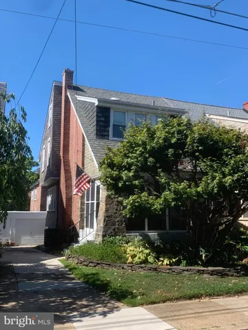 a view of house with yard