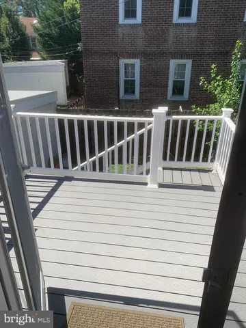 a view of a chair and table in the balcony