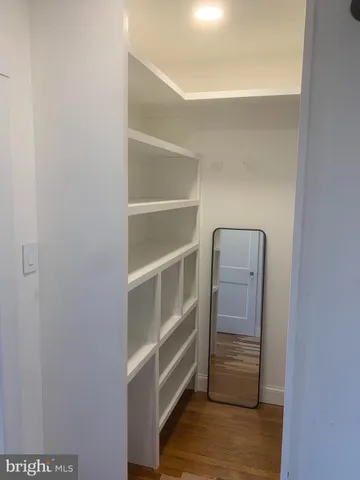 a storage room with wooden floor