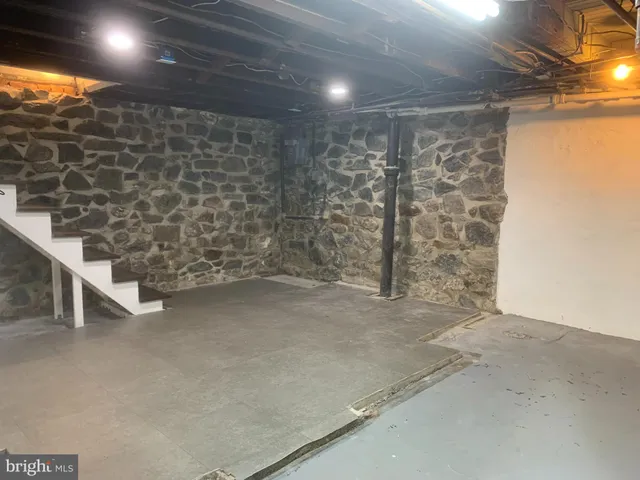 a view of an empty room with stairs
