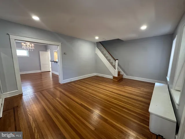 a view of a room with wooden floor
