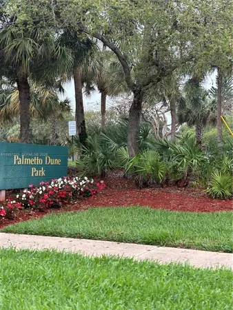 a view of a sign in front of house