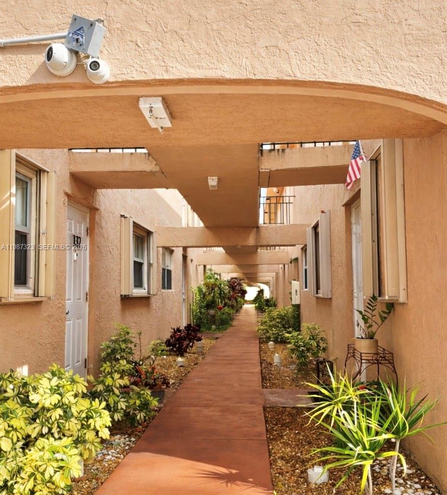 550 Southwest 2nd Avenue, Unit 1210 Boca Raton, FL 33432 - Photo 3 of 18 a front view of a house with a yard