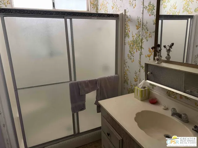 a bathroom with a sink and mirror