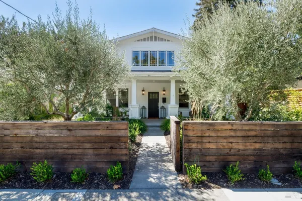 a front view of a house with garden