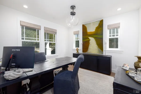 a workspace with furniture and window