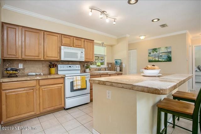 229 Dondanville Road St. Augustine, FL 32080 - Photo 11 of 22 a kitchen with stainless steel appliances granite countertop a sink and cabinets