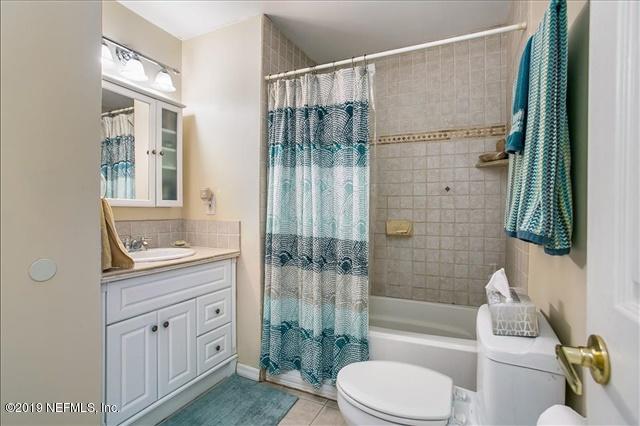 229 Dondanville Road St. Augustine, FL 32080 - Photo 14 of 22 a bathroom with a granite countertop sink toilet and shower