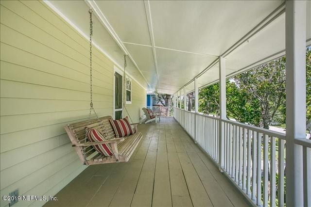 229 Dondanville Road St. Augustine, FL 32080 - Photo 18 of 22 a view of balcony with couch and wooden fence