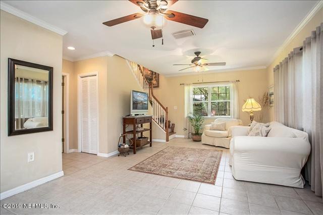 229 Dondanville Road St. Augustine, FL 32080 - Photo 3 of 22 a living room with furniture and a chandelier