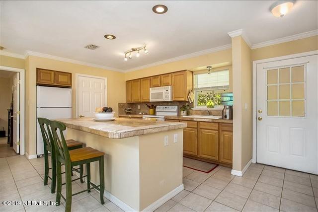 229 Dondanville Road St. Augustine, FL 32080 - Photo 9 of 22 a kitchen with appliances cabinets and chair