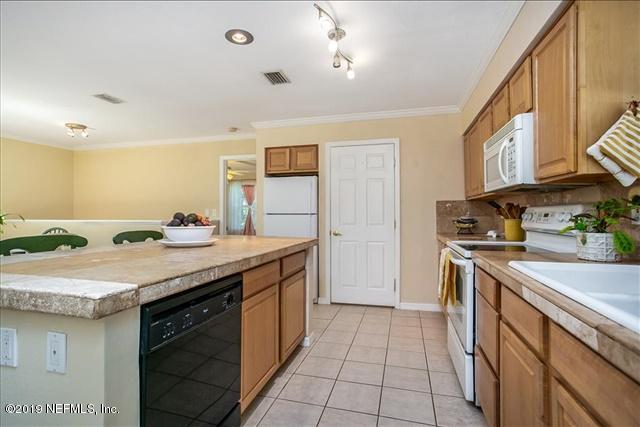 229 Dondanville Road St. Augustine, FL 32080 - Photo 10 of 22 a kitchen with a sink stove and cabinets