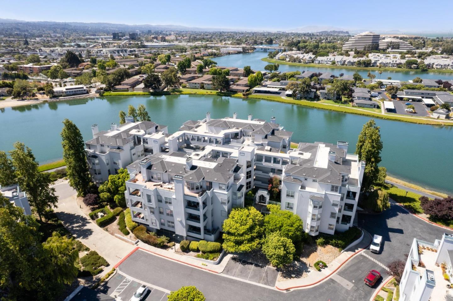 an aerial view of a city with lake view