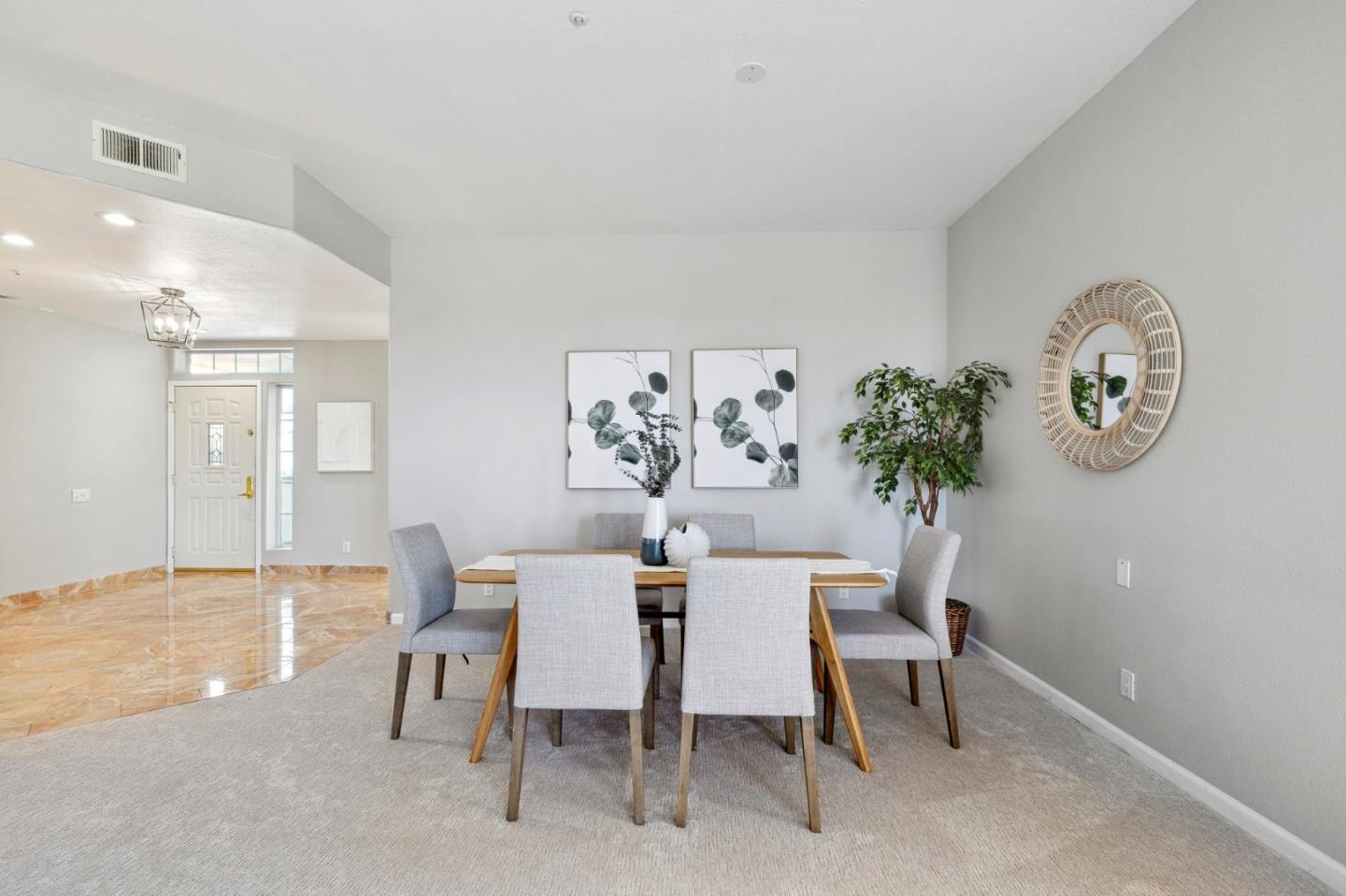 720 Promontory Point Lane, Unit 2305 Foster City, CA 94404 - Photo 30 of 78 a dining room with furniture and a chandelier