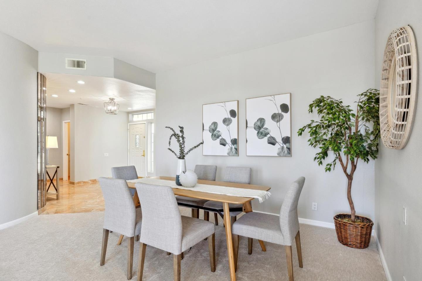 720 Promontory Point Lane, Unit 2305 Foster City, CA 94404 - Photo 31 of 78 a view of a dining room with furniture and a potted plant
