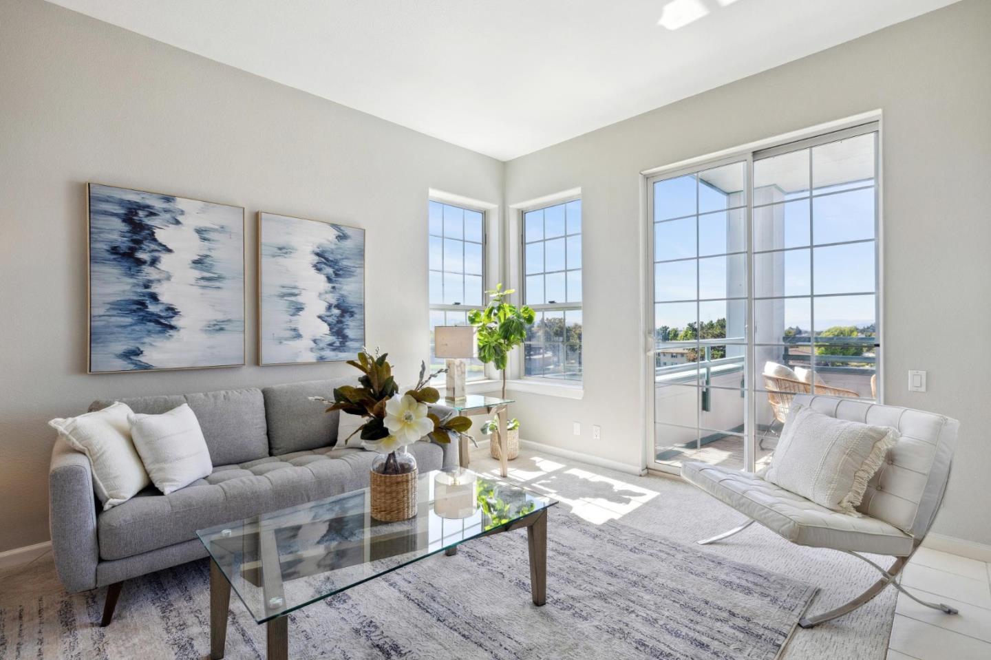 720 Promontory Point Lane, Unit 2305 Foster City, CA 94404 - Photo 34 of 78 a living room with furniture and a large window
