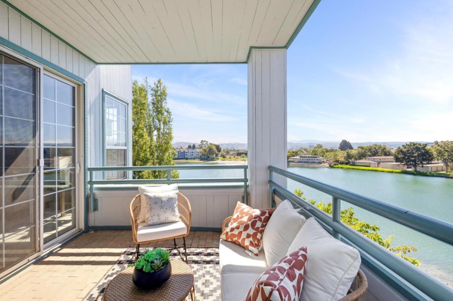 720 Promontory Point Lane, Unit 2305 Foster City, CA 94404 - Photo 39 of 78 a balcony with furniture and a potted plant