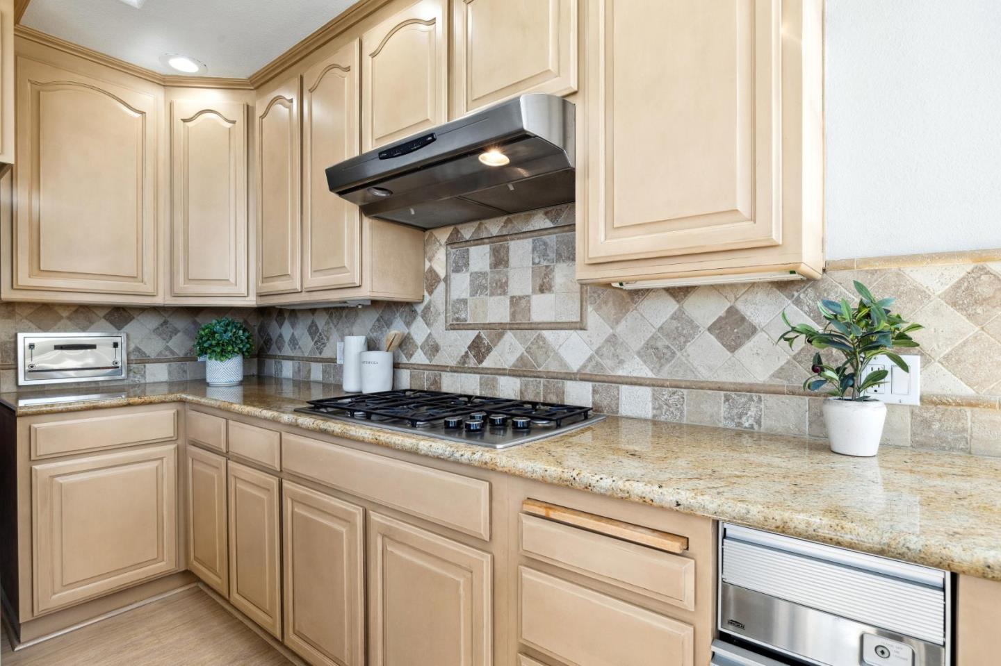 720 Promontory Point Lane, Unit 2305 Foster City, CA 94404 - Photo 45 of 78 a kitchen with stainless steel appliances granite countertop a sink a stove and cabinets