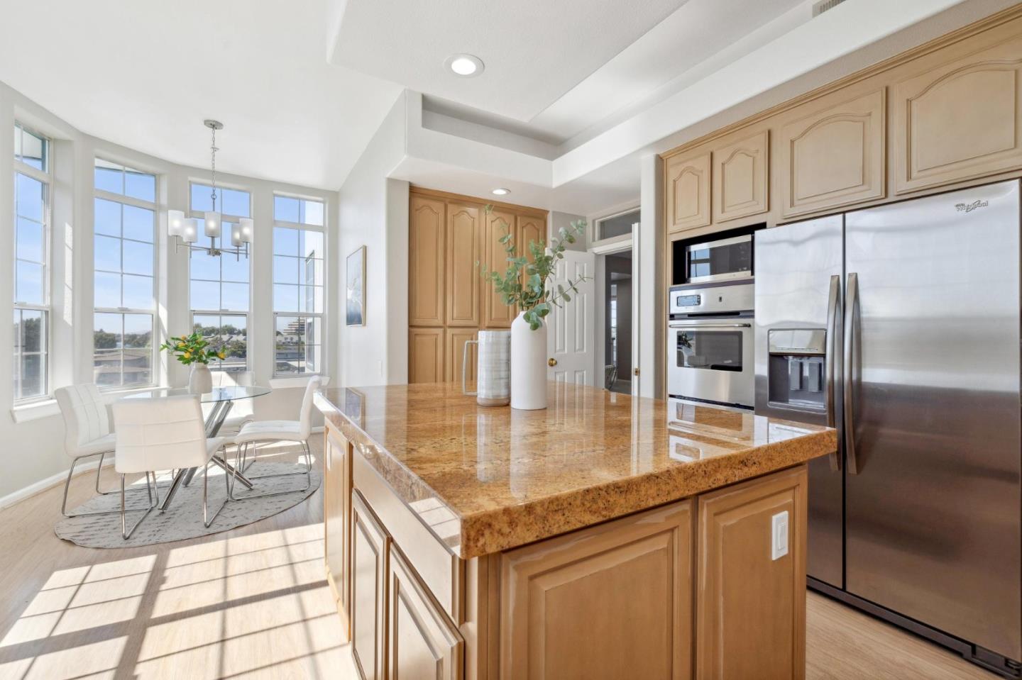 720 Promontory Point Lane, Unit 2305 Foster City, CA 94404 - Photo 46 of 78 a kitchen with stainless steel appliances granite countertop a refrigerator a stove and a sink
