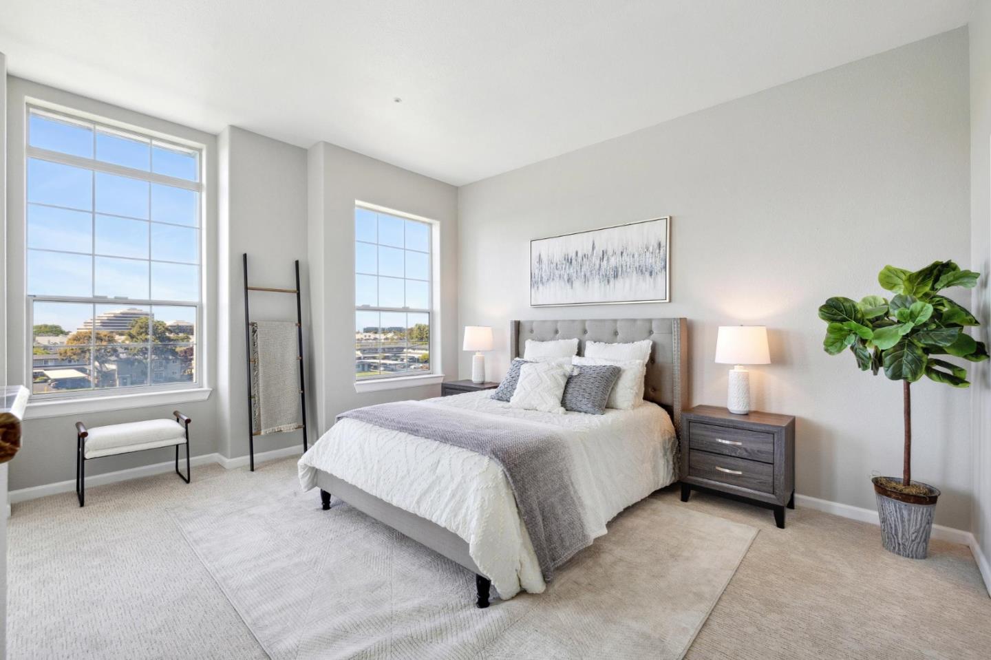 720 Promontory Point Lane, Unit 2305 Foster City, CA 94404 - Photo 49 of 78 a bedroom with a large bed and a potted plant