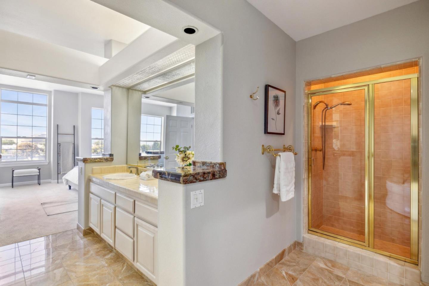 720 Promontory Point Lane, Unit 2305 Foster City, CA 94404 - Photo 58 of 78 a spacious bathroom with a double vanity sink a mirror a bathtub and next to a window