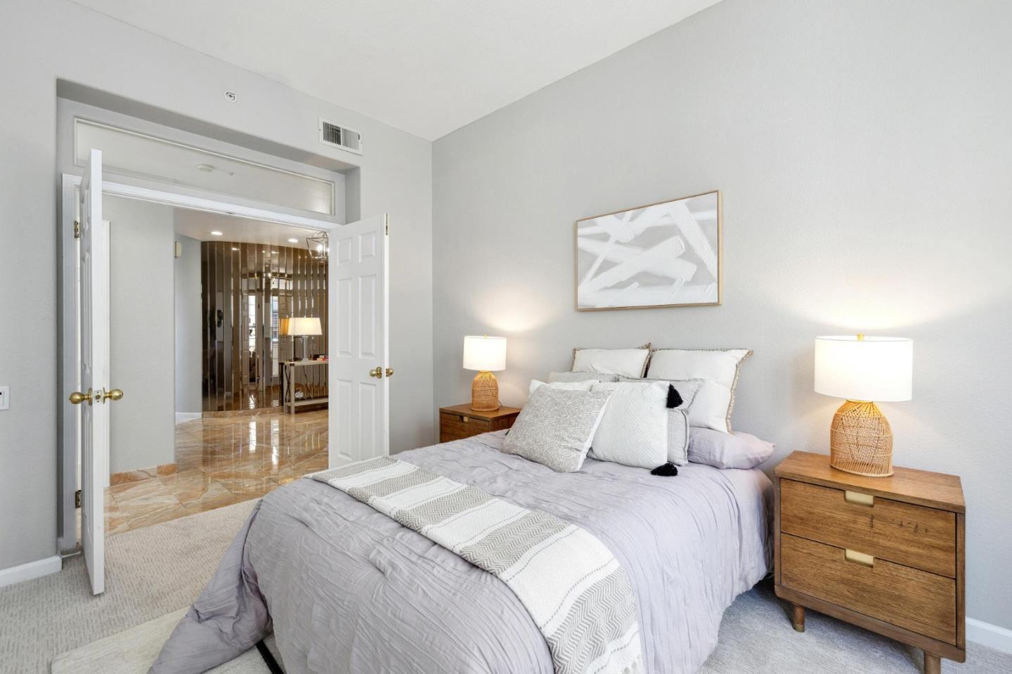 720 Promontory Point Lane, Unit 2305 Foster City, CA 94404 - Photo 63 of 78 a bedroom with a bed and a lamp