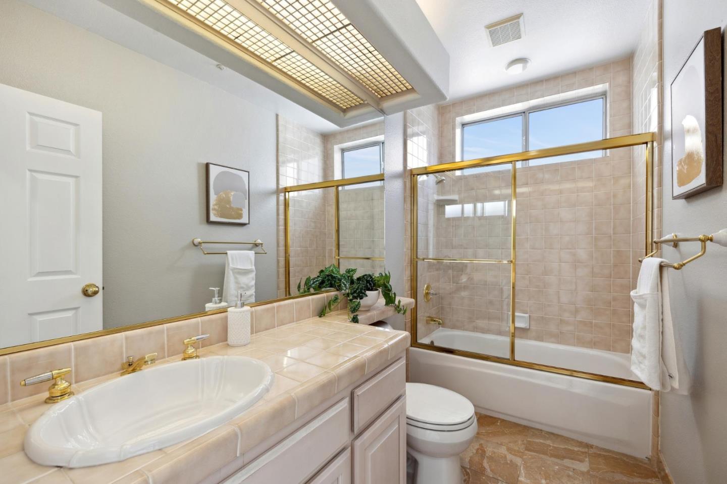 720 Promontory Point Lane, Unit 2305 Foster City, CA 94404 - Photo 70 of 78 a bathroom with a granite countertop sink a toilet and shower