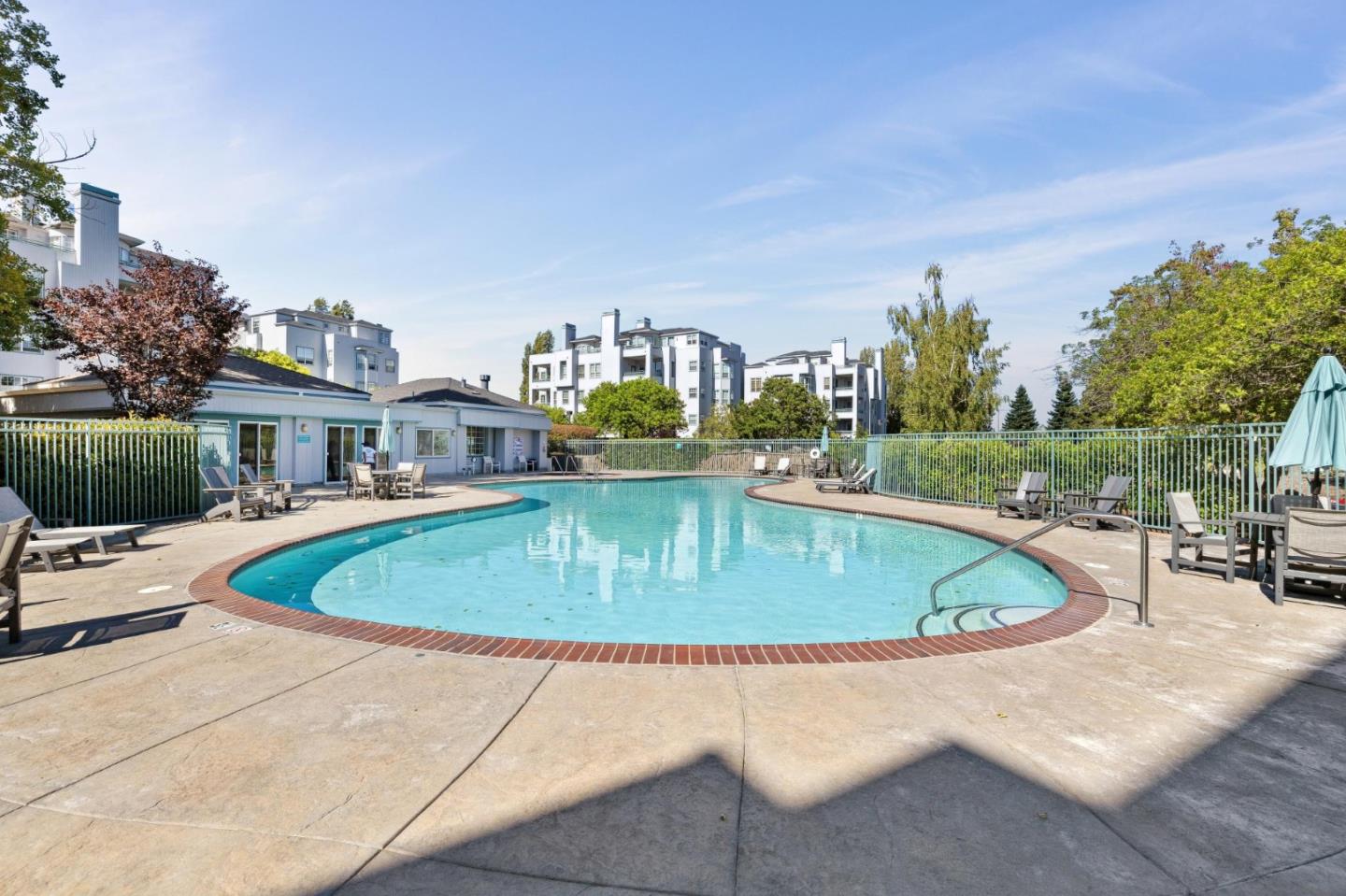 720 Promontory Point Lane, Unit 2305 Foster City, CA 94404 - Photo 75 of 78 a swimming pool with outdoor seating and barbeque oven