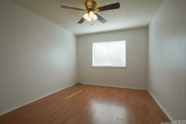 a bathroom with a bathtub shower sink vanity and toilet