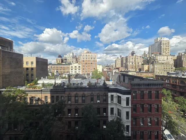 a view of a room that has a large window