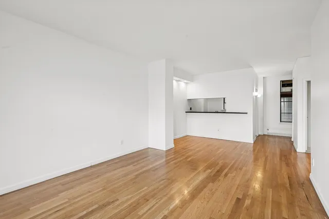 a view of kitchen and wooden floor