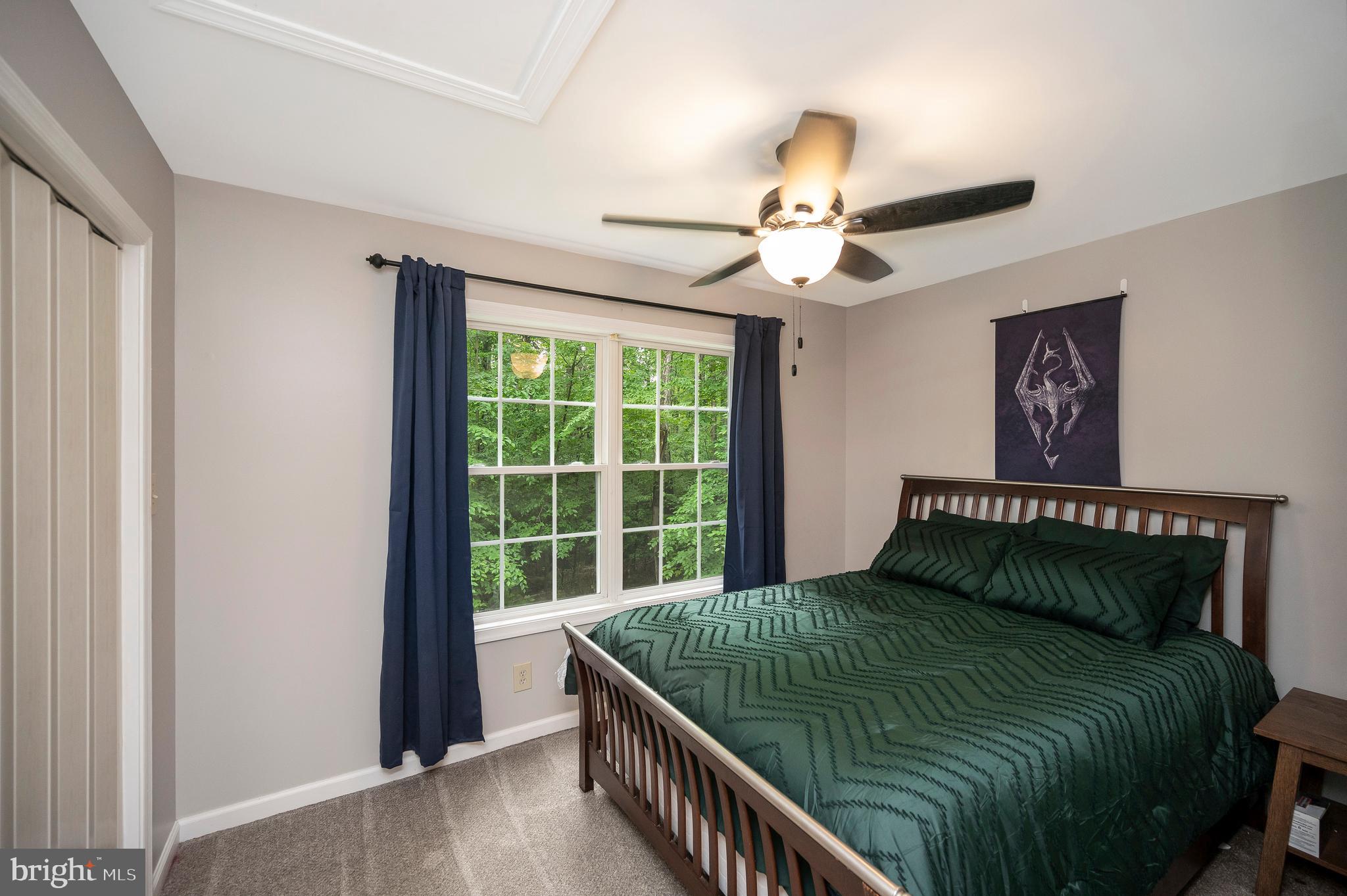 679 Cropp Road Fredericksburg, VA 22406 - Photo 29 of 39 a bedroom with a bed and a window