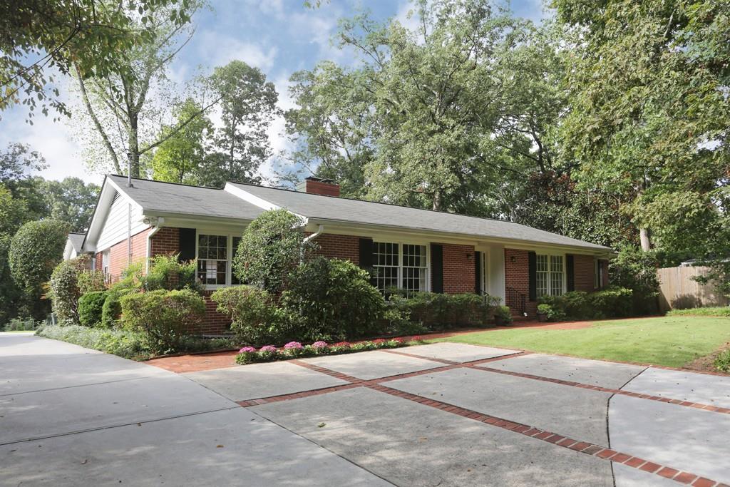 535 Timber Valley Road Northeast Atlanta, GA 30342 - Photo 1 of 1 2 Car garage in back and loads of parking in driveway and parking pad.