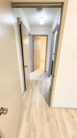 a view of a hallway with windows