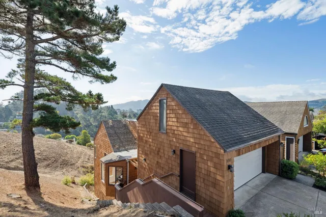 a aerial view of a house with a yard