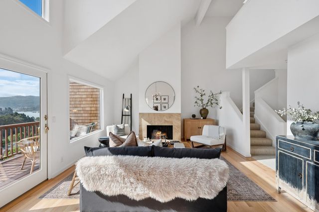 a bed room with furniture and a fireplace