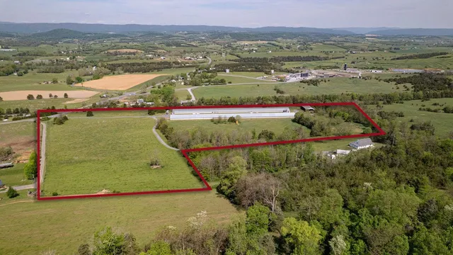 an aerial view of a residential houses with outdoor space