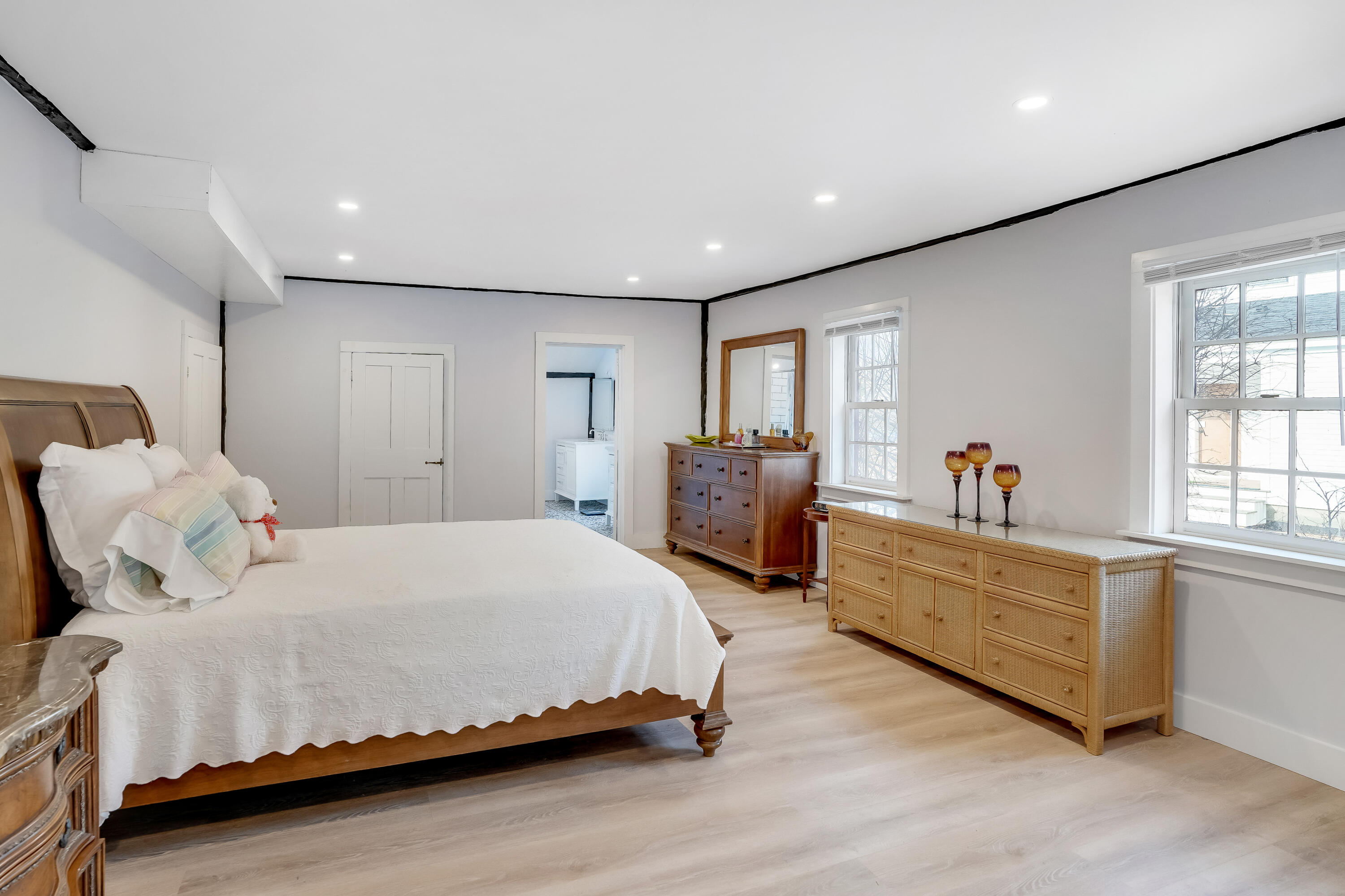 32 Norton Orchard Road Edgartown, MA 02539 - Photo 11 of 26 a spacious bedroom with a bed and a large window