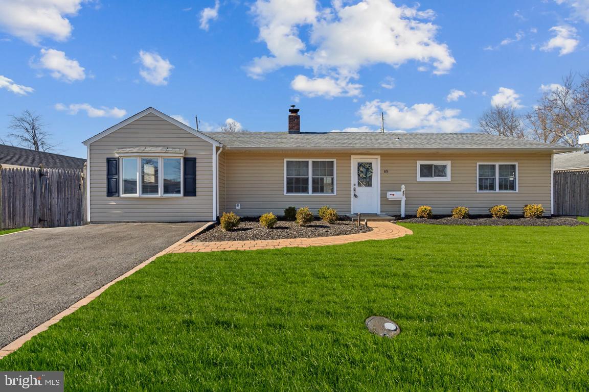 65 Gentle Road Levittown, PA 19057 - Photo 1 of 27 a view of a house with backyard and porch