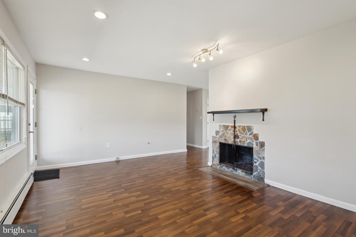 65 Gentle Road Levittown, PA 19057 - Photo 11 of 27 an empty room with wooden floor and ceiling fan