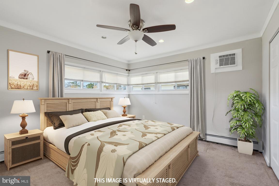 65 Gentle Road Levittown, PA 19057 - Photo 15 of 27 a bedroom with a bed and a potted plant